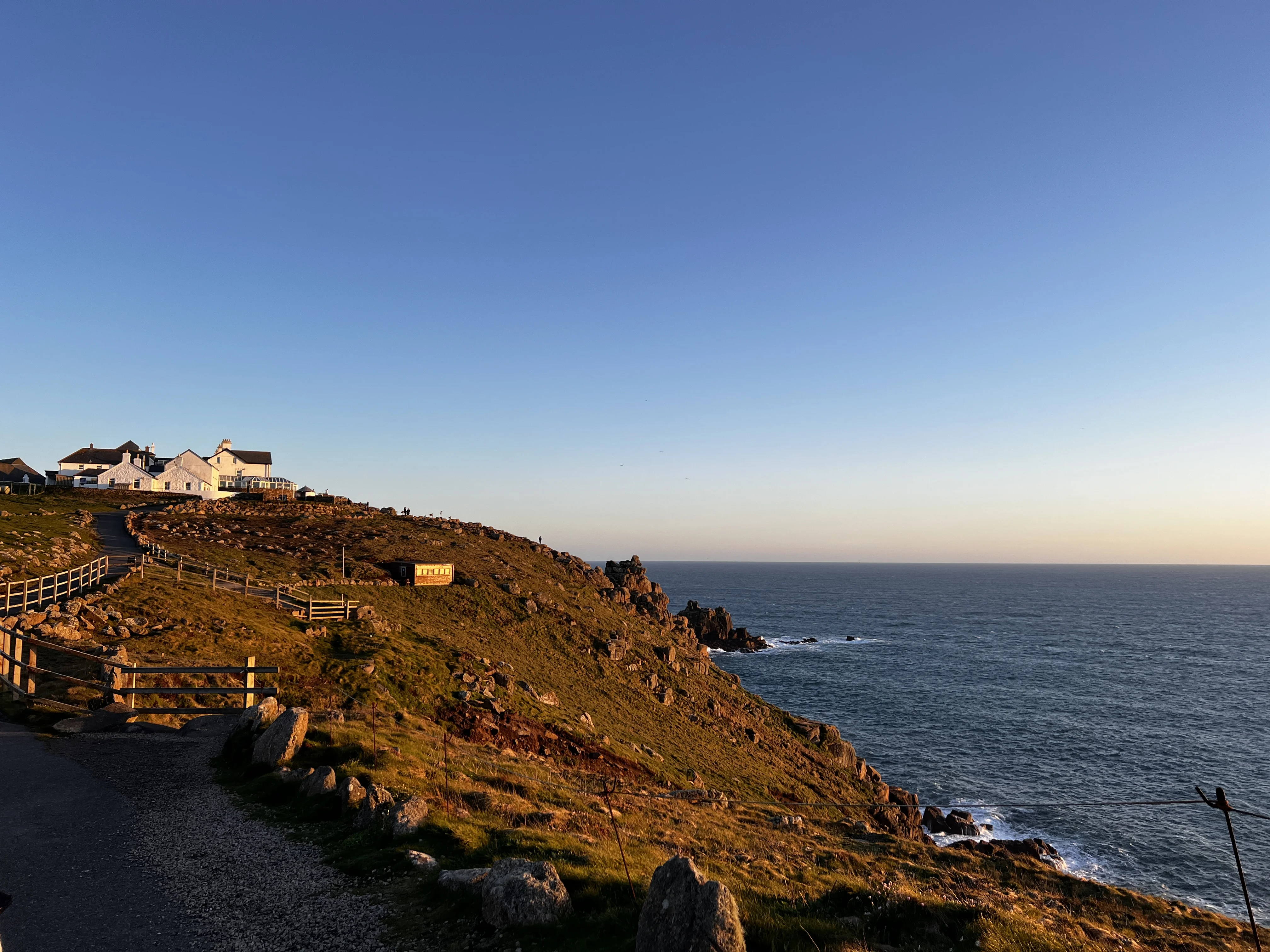 Narrow path along the cliffs with waves crashing below